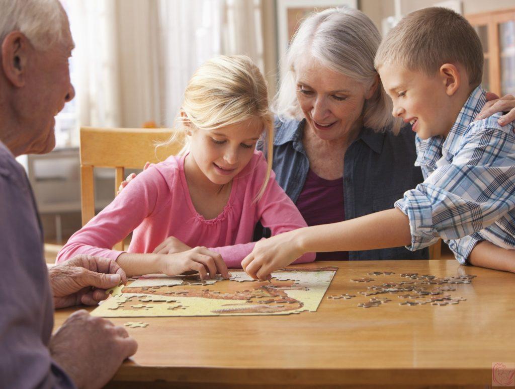 Children doing puzzle at table
